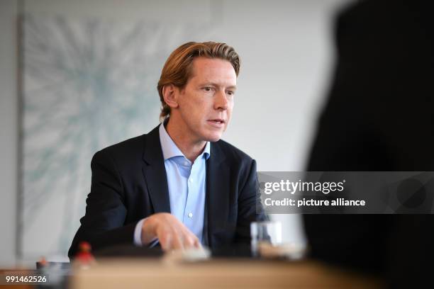 Chairman of the Ravensburg Group Clemens Maier gives a talk in his office in the headquarters of the company in Ravensburg, Germany, 6 November 2017....