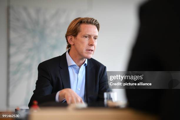 Chairman of the Ravensburg Group Clemens Maier talks in his office in the headquarters of the company in Ravensburg, Germany, 6 November 2017. Photo:...