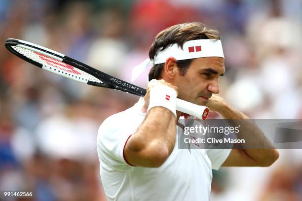 Roger Federer of Switzerland prepares to play his Men's Singles second round match against Lukas Lacko of Slovakia on day three of the Wimbledon Lawn...
