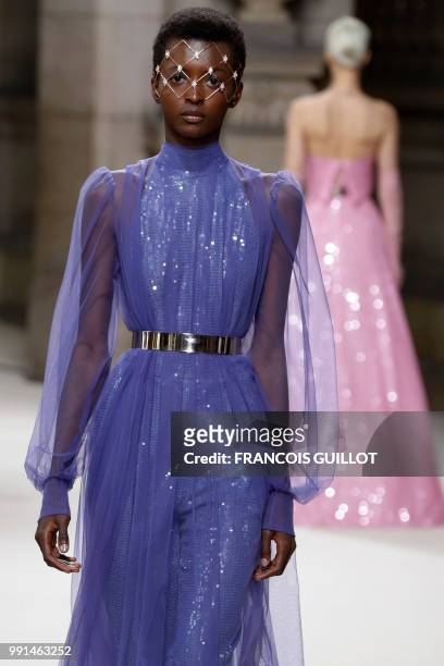 Model presents a creation by Galia Lahav during the 2018-2019 Fall/Winter Haute Couture collection fashion show in Paris, on July 4, 2018.