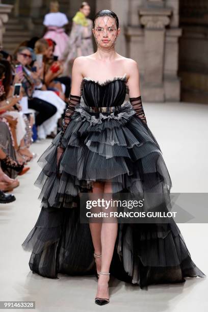 Model presents a creation by Galia Lahav during the 2018-2019 Fall/Winter Haute Couture collection fashion show in Paris, on July 4, 2018.