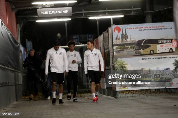 Germany's Sami Khedira , Leroy Sané and Mesut Ozil arriving to the German national soccer squad's training in the Sudstadion in Cologne, Germany, 12...