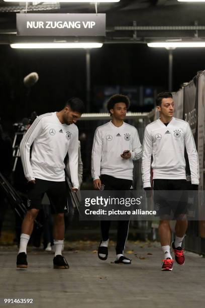 Germany's Sami Khedira , Leroy Sané and Mesut Ozil arriving to the German national soccer squad's training in the Sudstadion in Cologne, Germany, 12...