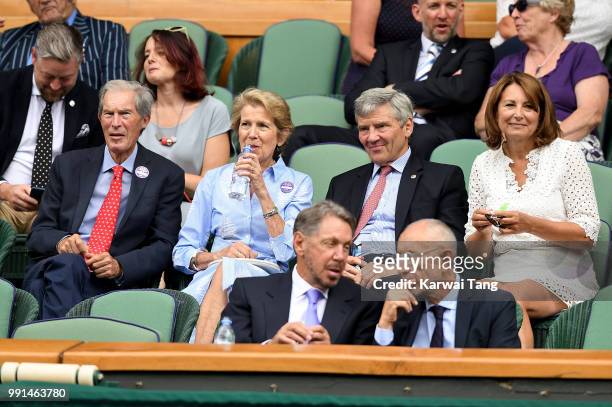 Tony and Jane Henman, Michael and Carole Middleton sit in the royal box on day three of the Wimbledon Tennis Championships at the All England Lawn...