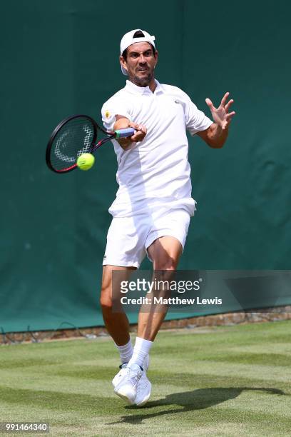 Guillermo Garcia-Lopez of Spain returns against Daniil Medvedev of Russia during their Men's Singles second round match on day three of the Wimbledon...
