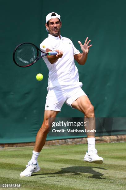 Guillermo Garcia-Lopez of Spain returns against Daniil Medvedev of Russia during their Men's Singles second round match on day three of the Wimbledon...