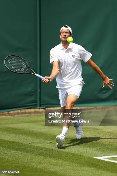 Guillermo Garcia-Lopez of Spain returns against Daniil Medvedev of Russia during their Men's Singles second round match on day three of the Wimbledon...