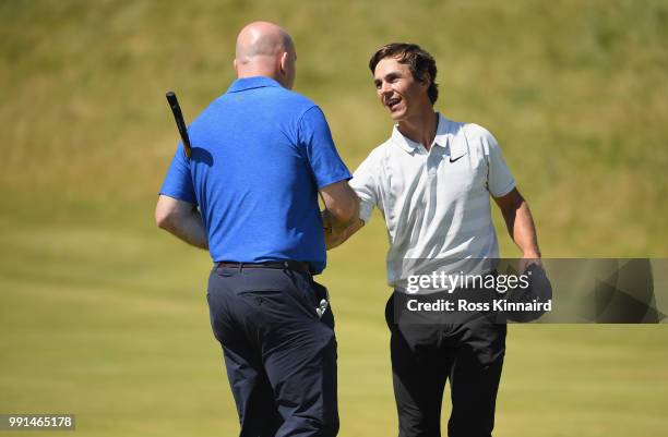 Former Irish rugby star Keith Wood and Thorbjorn Olesen of Denmark on the 18th green during the pro-am event prior to the Dubai Duty Free Irish Open...