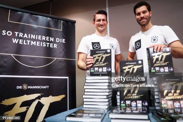 Benjamin Kugel and Nicklas Dietrich, fitness trainers of the German national soccer team, presenting the book "Fit like the National Squad" in...