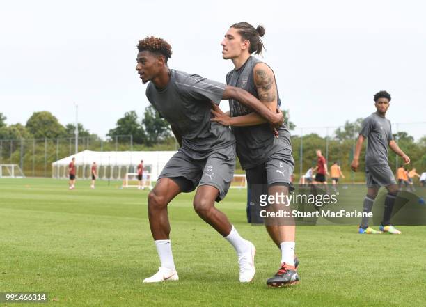 Jeff Reine-Adelaide and Hector Bellerin of Arsenal look on during a training session at London Colney on July 4, 2018 in St Albans, England.
