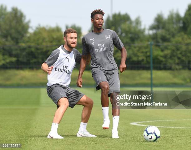 Shkodran Mustafi and Jeff Reine-Adelaide of Arsenal during a training session at London Colney on July 4, 2018 in St Albans, England.