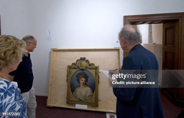 July 2018, Woerlitz, Germany: The Painting "Baccantin - Half Figure in the Painted High Oval" by the artist Angelika Kauffmann , can be seen during a...