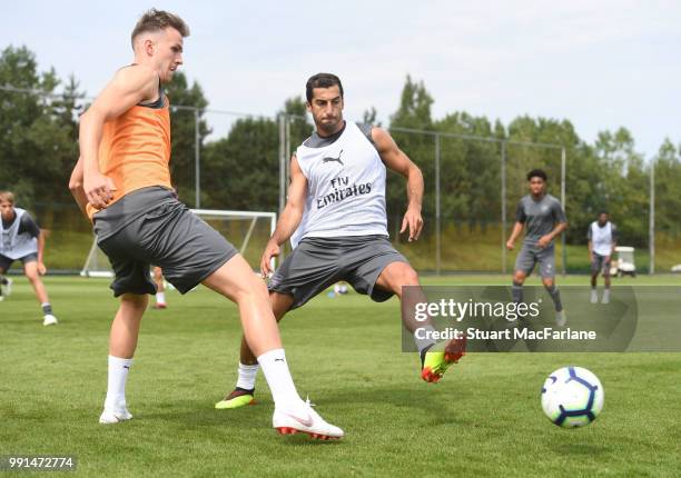 Rob Holding and Henrikh Mkhitaryan of Arsenal during a training session at London Colney on July 4, 2018 in St Albans, England.