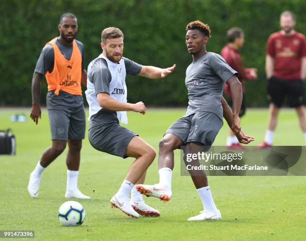 Shkodran Mustafi and Jeff Reine-Adelaide of Arsenal during a training session at London Colney on July 4, 2018 in St Albans, England.