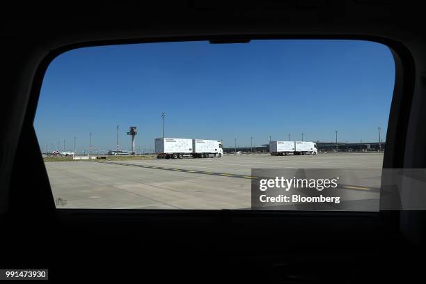 Pair of MAN SE TGX freight trucks stand on the tarmac during a wireless communication technology "platooning" test driving event at Berlin ExpoCenter...