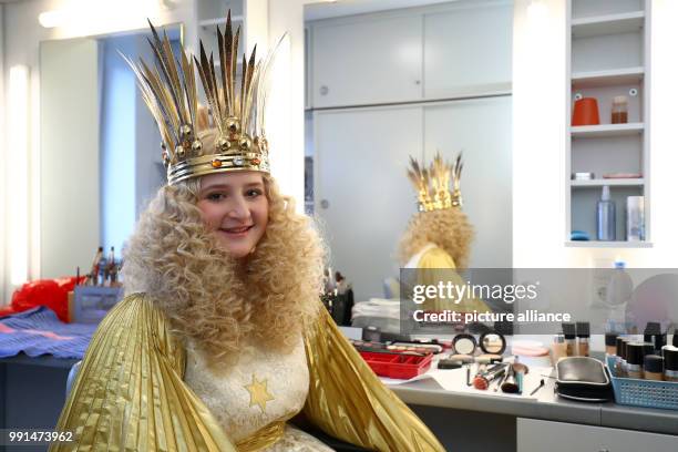 The Nuremberg Baby Jesus, Rebecca Ammon, standing in the makeup room during the outfitting in her offical garment at the state theatre in Nuremberg,...