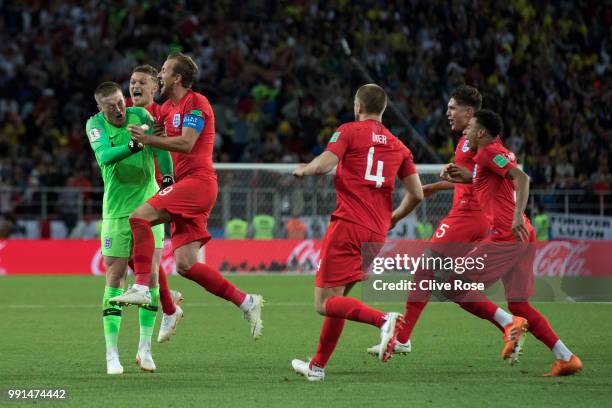Jordan Pickford of England is mobbed by teammates in celebration after penalty shootout following the 2018 FIFA World Cup Russia Round of 16 match...