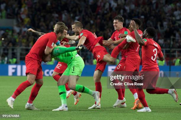 Jordan Pickford of England is mobbed by teammates in celebration after penalty shootout following the 2018 FIFA World Cup Russia Round of 16 match...