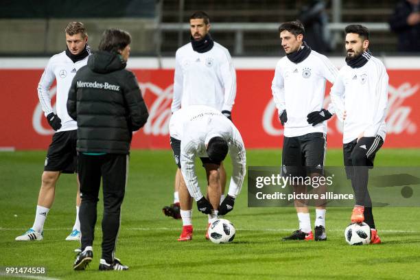 The coach of the German national team, Joachim Loew talking to Toni Kroos , Sami Khedira, Emre Can, Lars Stindl and Ilkay Guendogan during the...