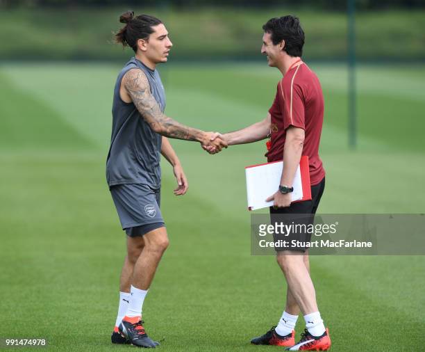 Arsenal Head Coach Unai Emery and Hector Bellerin during a training session at London Colney on July 4, 2018 in St Albans, England.
