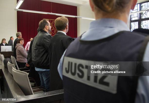 The accused Angelika W. And Wilfried W. Stand at the jury court room in the county court in Paderborn, Germany, 14 November 2017. The county jury is...