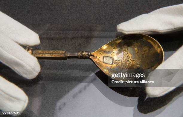 Travel spoon which was carried by Martin Luther during his travels is held by a gloved hand in Stuttgart, Germany, 14 November 2017. The spoon is on...