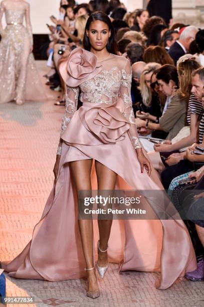 Model Cindy Bruna walks the runway during the Elie Saab Haute Couture Fall Winter 2018/2019 show as part of Paris Fashion Week on July 4, 2018 in...