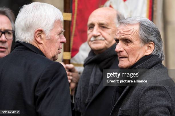 President of 1. FC Koeln, Werner Spinner and his predecessor Wolfgang Overath stand together during the funeral of departed former soccer player Hans...