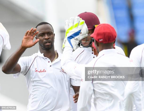 Kemar Roach of West Indies celebrates the dismissal of Shakib Al Hasan of Bangladesh during day 1 of the 1st Test between West Indies and Bangladesh...