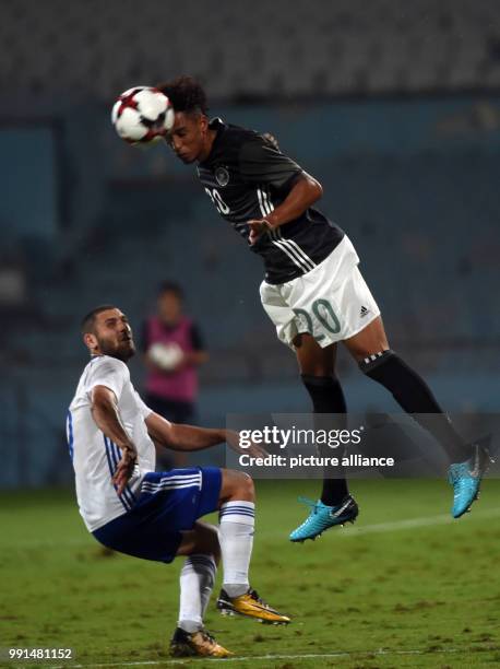 Germany's Thilo Kehrer and Israel's Shon Weissman vying for the ball during the Under 21 European Qualifying Round 1. Group 5 soccer match between...