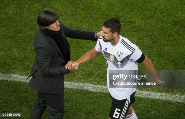 Germany's Sami Khedira being substituted by head coach Joachim Low during the international soccer match between Germany and France in Cologne,...