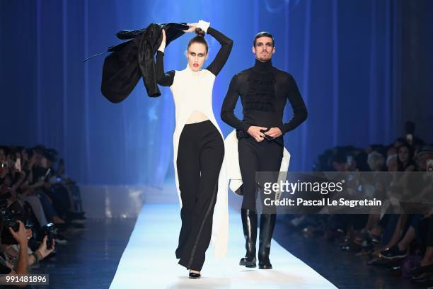 Anna Cleveland and a male model walk the runway during the Jean-Paul Gaultier Haute Couture Fall Winter 2018/2019 show as part of Paris Fashion Week...