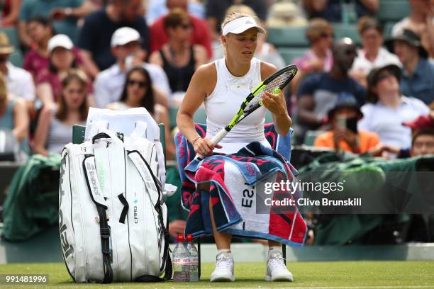 Caroline Wozniacki of Denmark during a break during her Ladies' Singles second round match against Ekaterina Makarova of Russia on day three of the...