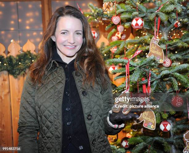 American actress Kristin Davis standing next to a Christmas tree during the traditional inaguration of the Christmas market at the Aiderbichl Manor...