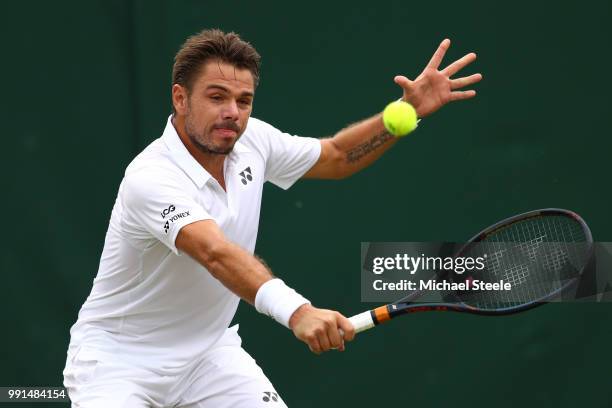 Stan Wawrinka of Switzerland returns against Thomas Fabbiano of Italy during their Men's Singles second round match on day three of the Wimbledon...