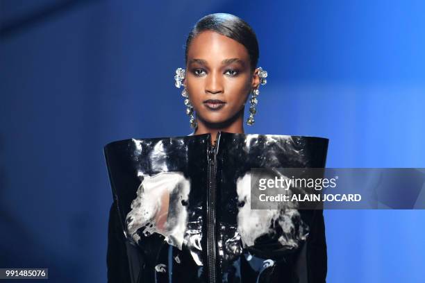Model presents a creation by Jean-Paul Gaultier during the 2018-2019 Fall/Winter Haute Couture collection fashion show in Paris, on July 4, 2018.