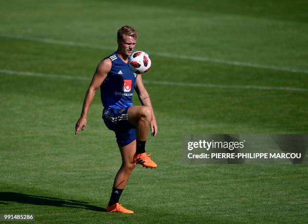 Sweden's midfielder Oscar Hiljemark controls a ball during a training session at Spartak stadium in Gelendzhik on July 4 during the Russia 2018 World...