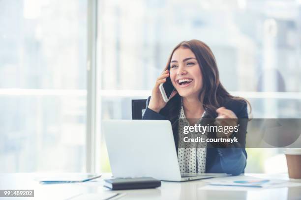 business woman working and talking on a mobile phone. - fun experience stock pictures, royalty-free photos & images