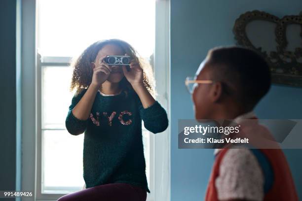 friends playing with binoculars - viewmaster stock pictures, royalty-free photos & images