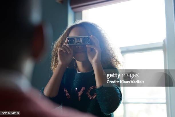 friends playing with binoculars - klaus vedfelt stock-fotos und bilder