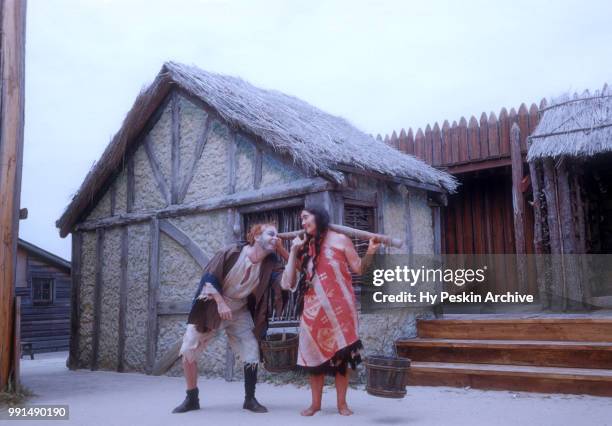 Two actors dressed in costumes act in a scene at The Renaissance Pleasure Faire circa 1960's in San Francisco, California.