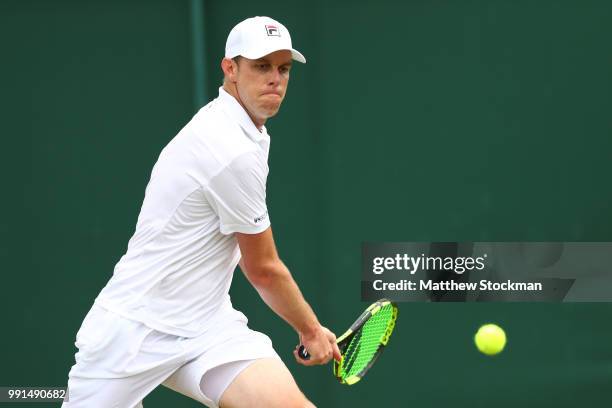 Sam Querry of The United States returns against Sergiy Stakhovsky of Ukraine during their Men's Singles second round match on day three of the...