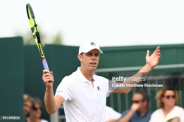 Sam Querry of The United States reacts during his Men's Singles second round match against Sergiy Stakhovsky on day three of the Wimbledon Lawn...