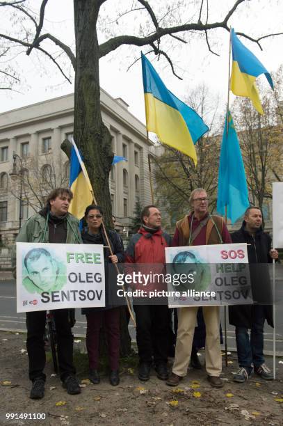 Protesters holding banners and Ukrainian flags in front of the Russian embassy during a protest in Berlin, Germany, 15 November 2017. The protesters...