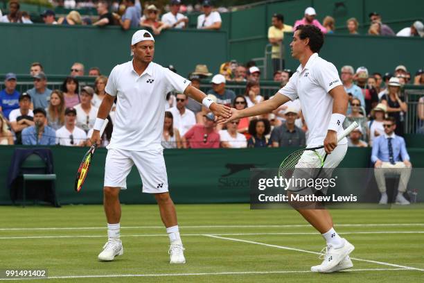 Alex Bolt of Australia and Lleyton Hewitt of Australia celebrate a point against Raven Klaasen of South Africa and Michael Venus of New Zealand...