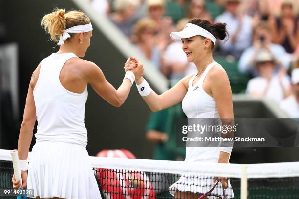 Lucie Safarova of Poland shakes hands with Agnieszka Radwanska of Poland after their Ladies' Singles second round match on day three of the Wimbledon...