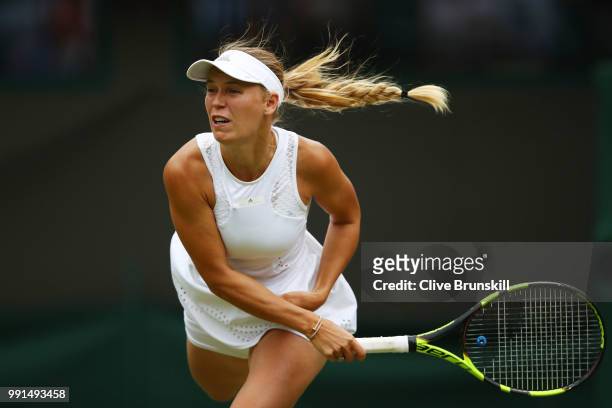 Caroline Wozniacki of Denmark in action against Ekaterina Makarova of Russia during their Ladies' Singles second round match on day three of the...