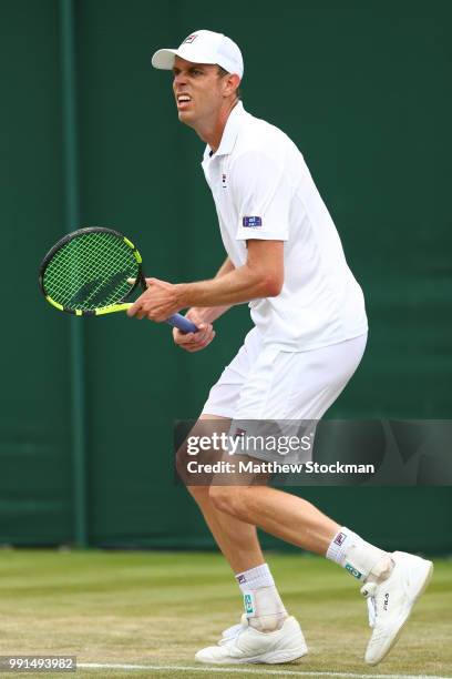 Sam Querry of The United States reacts during his Men's Singles second round match against Sergiy Stakhovsky on day three of the Wimbledon Lawn...