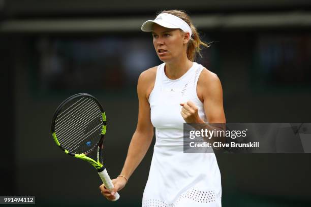 Caroline Wozniacki of Denmark celebrates a point against Ekaterina Makarova of Russia during their Ladies' Singles second round match on day three of...