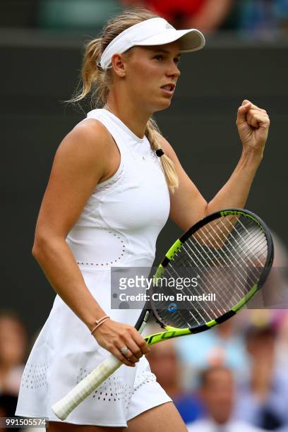 Caroline Wozniacki of Denmark celebrates a point against Ekaterina Makarova of Russia during their Ladies' Singles second round match on day three of...
